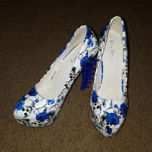 Blue spine heels with roses and skulls
